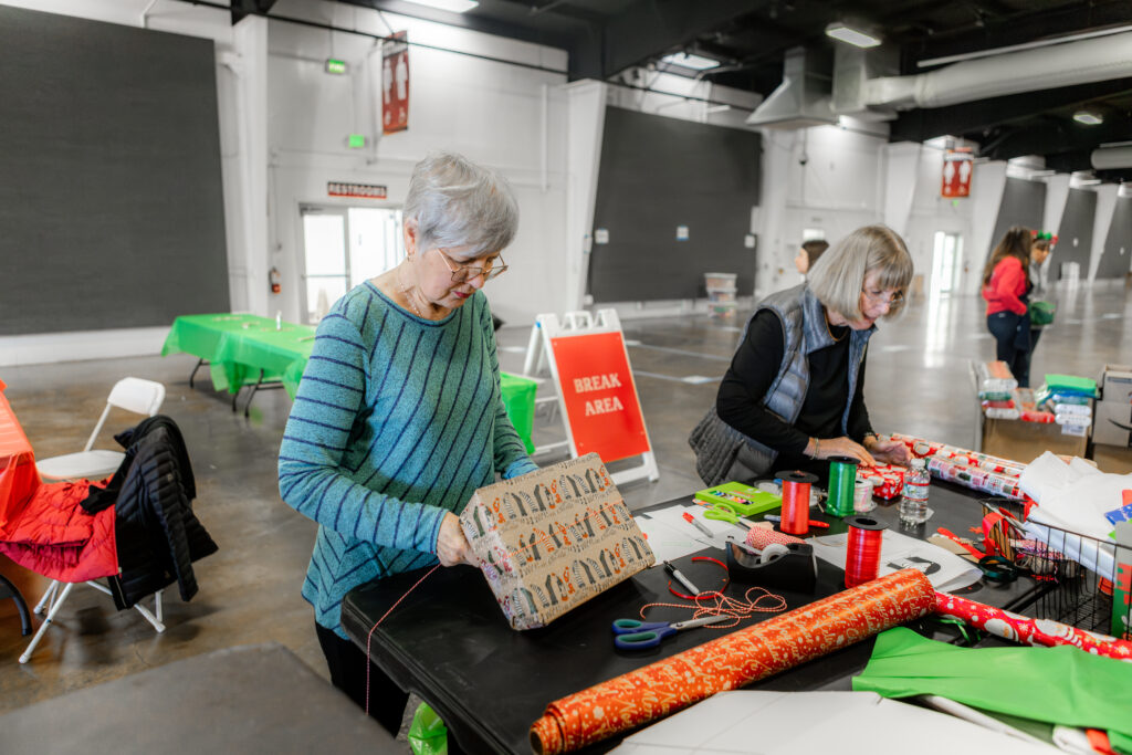 volunteers wrapping gifts