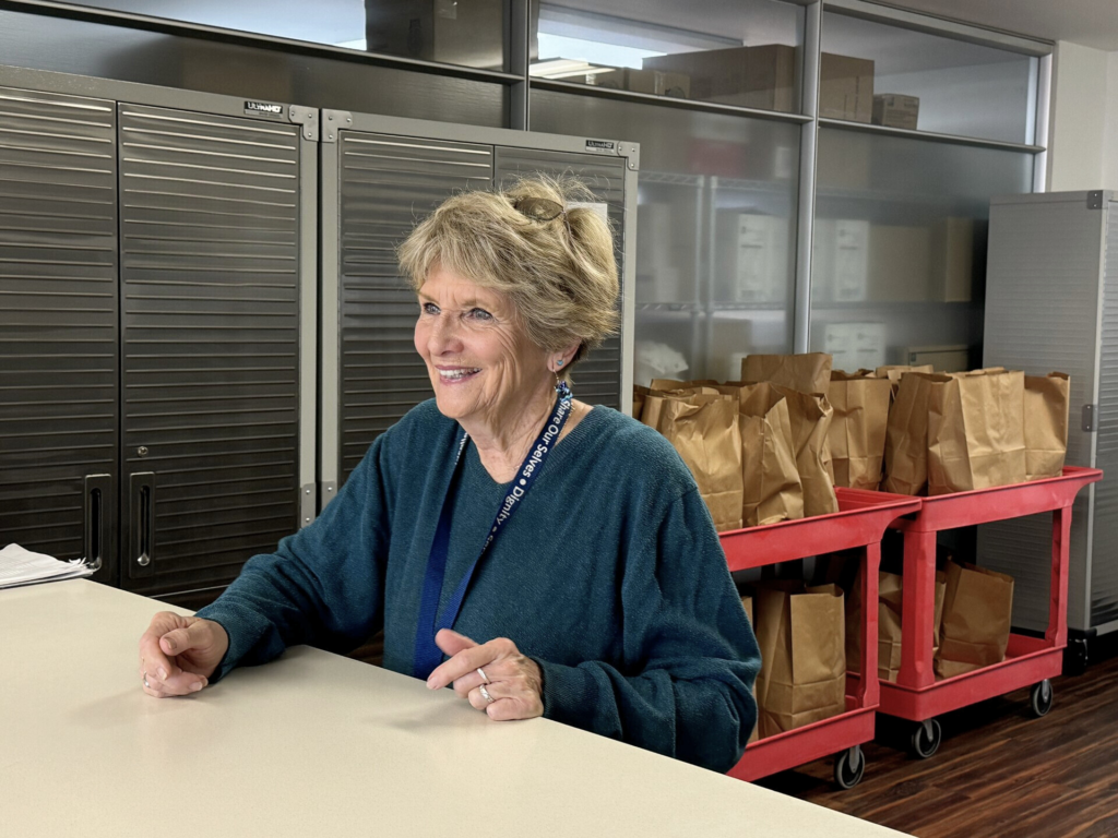 Volunteer Kathy Stefano at the Share Ourselves distribution window in Costa Mesa