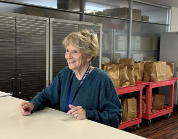 Volunteer Kathy Stefano at the Share Ourselves distribution window in Costa Mesa