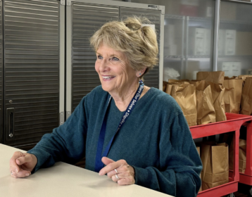 Volunteer Kathy Stefano at the Share Ourselves distribution window in Costa Mesa